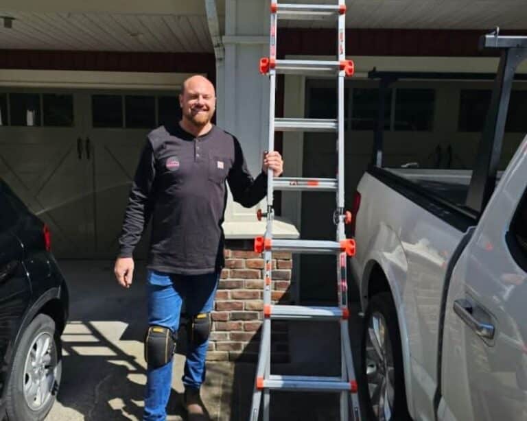 Man with ladder near truck